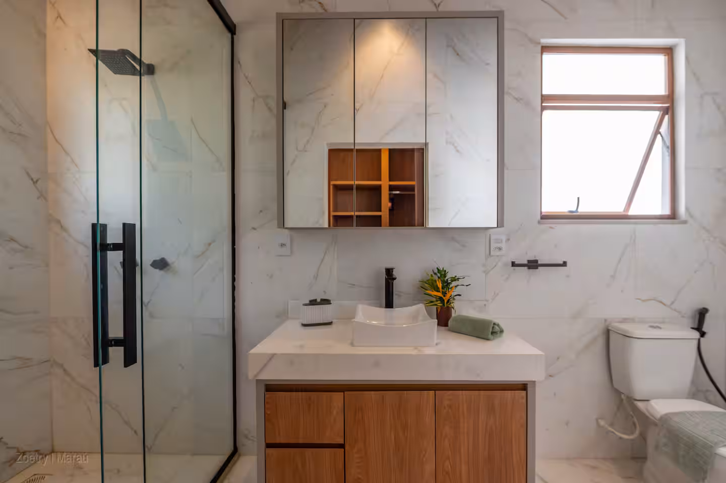 Second bathroom with marble and glass shower